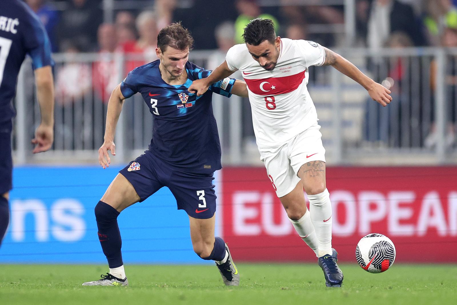 12.10.2023., Opus Arena, Osijek - Kvalifikacije za UEFA Europsko prvenstvo 2024., skupina D, 7. kolo, Hrvatska - Turska. Borna Barisic, Irfan Can Kahveci Photo: Igor Kralj/PIXSELL