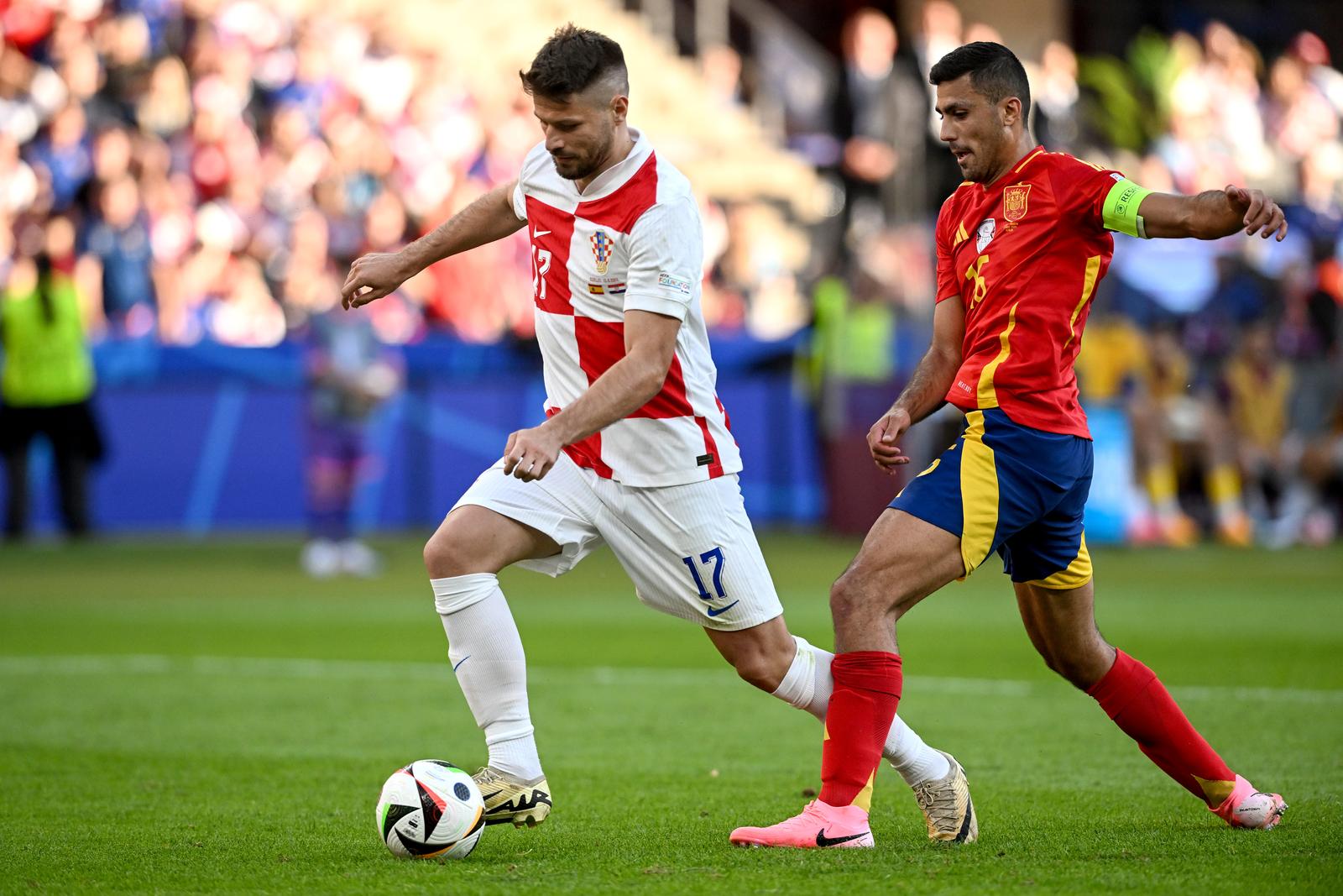 15.06.2024., Olimpijski stadion, Berlin, Njemacka - Europsko prvenstvo 2024., skupina B, 1. kolo, Spanjolska - Hrvatska. Bruno Petkovic, Rodri. Photo: Marko Lukunic/PIXSELL