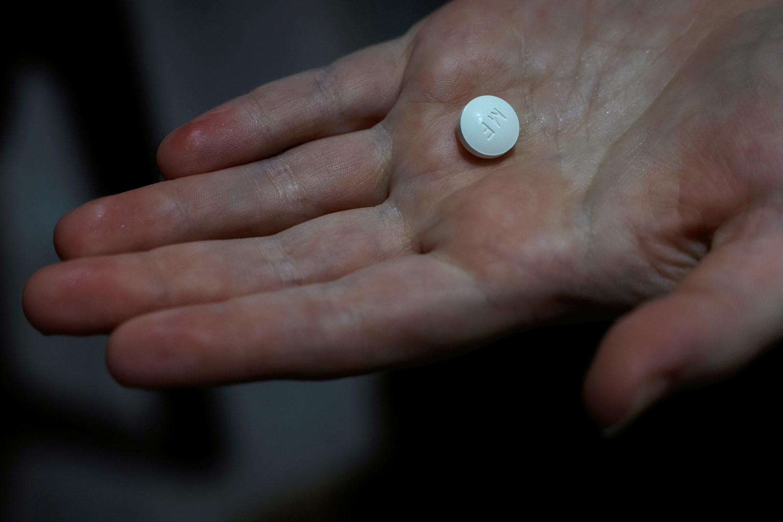 FILE PHOTO: A patient prepares to take Mifepristone, the first pill in a medical abortion, at Alamo Women's Clinic in Carbondale, Illinois, U.S., April 9, 2024. REUTERS/Evelyn Hockstein/File Photo Photo: Evelyn Hockstein/REUTERS