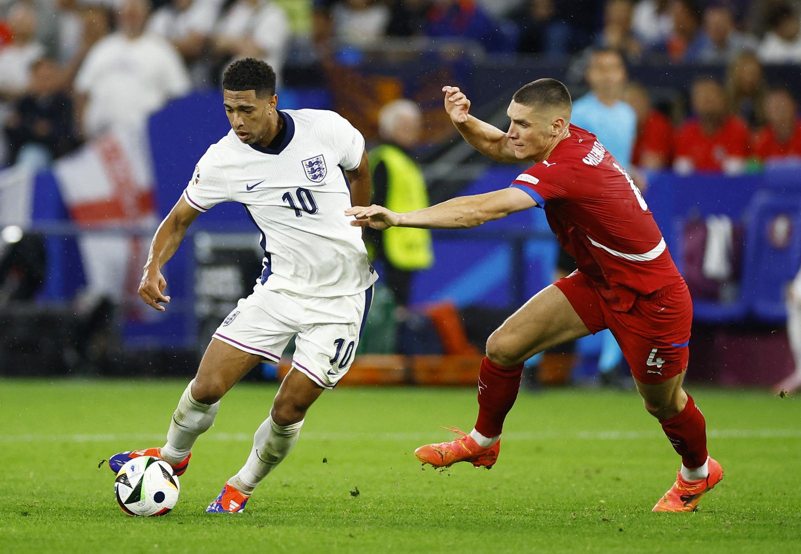 Soccer Football - Euro 2024 - Group C - Serbia v England - Arena AufSchalke, Gelsenkirchen, Germany - June 16, 2024 England's Jude Bellingham in action with Serbia's Nikola Milenkovic REUTERS/John Sibley Photo: John Sibley/REUTERS