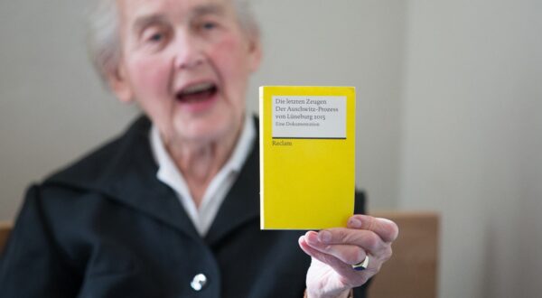 Defendant and notorious Holocaust denier Ursula Haverbeck holds up a booklet titled "The Last Witnesses - The Auschwitz-Trial of Lueneburg 2015 - A Documentary" during her trial at a courtroom of the district court in Detmold, western Germany, on September 2, 2016. Haverbeck is accused of incitement of the masses.,Image: 298607346, License: Rights-managed, Restrictions: Germany OUT, Model Release: no, Credit line: Friso Gentsch / AFP / Profimedia