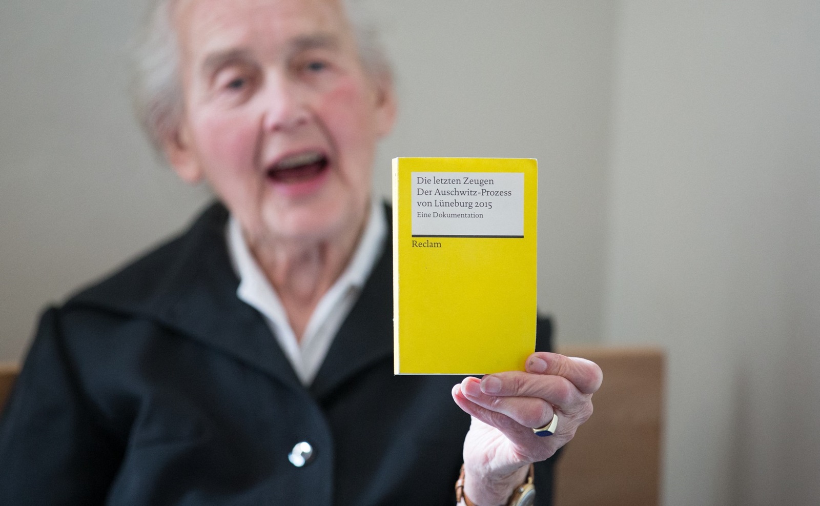 Defendant and notorious Holocaust denier Ursula Haverbeck holds up a booklet titled "The Last Witnesses - The Auschwitz-Trial of Lueneburg 2015 - A Documentary" during her trial at a courtroom of the district court in Detmold, western Germany, on September 2, 2016. Haverbeck is accused of incitement of the masses.,Image: 298607346, License: Rights-managed, Restrictions: Germany OUT, Model Release: no, Credit line: Friso Gentsch / AFP / Profimedia