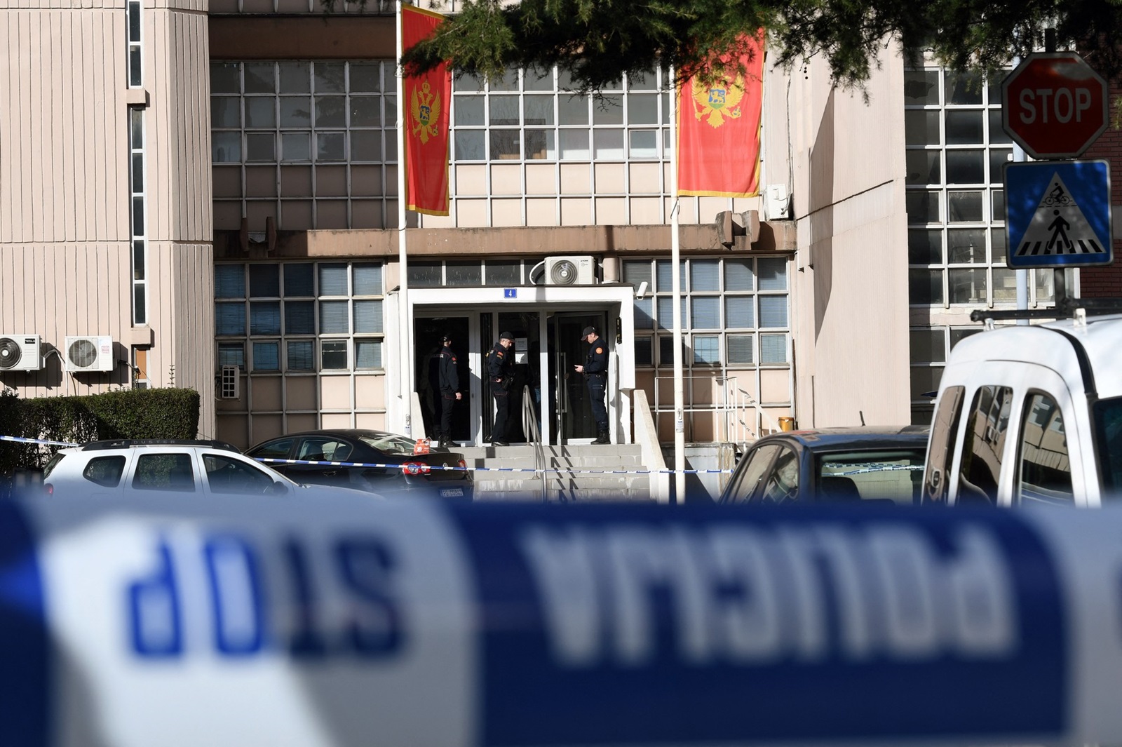 Montenegrin police officers and investigators stand at the entrance to Podgorica County Court, on March 3, 2023. A suicide bomber detonated an explosive device inside the courthouse on March 3, killing himself and injuring 8 persons, two of whom sustained life threatening injuries. The incident happened at Montenegro's Basic Court, a lower judiciary body that handles municipal cases in the capital.,Image: 760102428, License: Rights-managed, Restrictions: , Model Release: no, Credit line: SAVO PRELEVIC / AFP / Profimedia