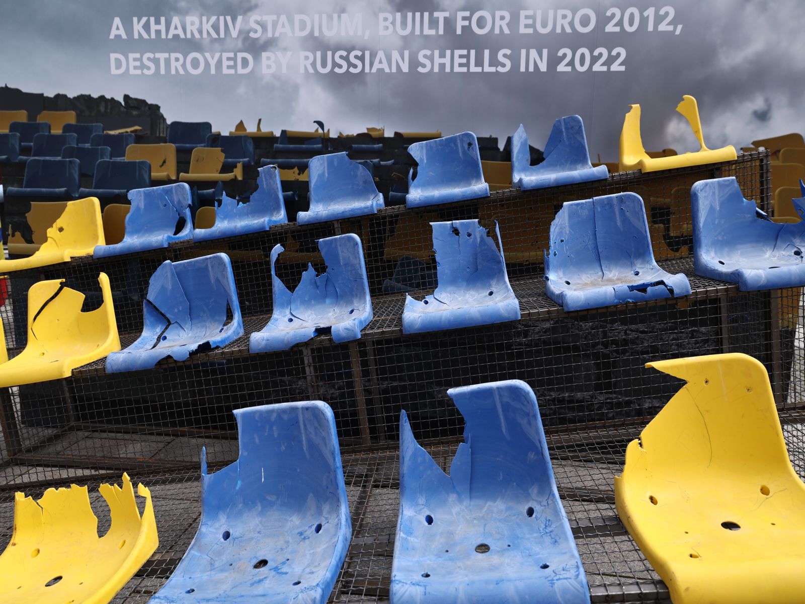 epa11417264 Damaged seats from a stadium in Kharkiv, Ukraine, exhibited  as an installation at Wittelsbacherplatz in Munich, Germany, 17 June 2024. Ukraine was a co-host for the UEFA EURO 2012 soccer tournament and the stadium was damaged during shelling amid the ongoing Russian invasion. Ukraine’s national team will face Romania in their UEFA EURO 2024 debut match in Munich, Germany, on 17 June.  EPA/ANNA SZILAGYI