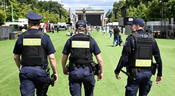 Police patrols on artificial grass on the street towards Berlin's landmark the Brandenburg Gate as preparations are under way on June 13, 2024 for a public viewing area during the UEFA Euro 2024 European Football Championship running from June 14 to July 14, 2024 across the country.,Image: 881332988, License: Rights-managed, Restrictions: , Model Release: no, Credit line: RALF HIRSCHBERGER / AFP / Profimedia