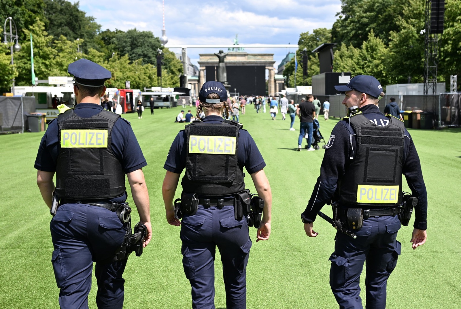 Police patrols on artificial grass on the street towards Berlin's landmark the Brandenburg Gate as preparations are under way on June 13, 2024 for a public viewing area during the UEFA Euro 2024 European Football Championship running from June 14 to July 14, 2024 across the country.,Image: 881332988, License: Rights-managed, Restrictions: , Model Release: no, Credit line: RALF HIRSCHBERGER / AFP / Profimedia