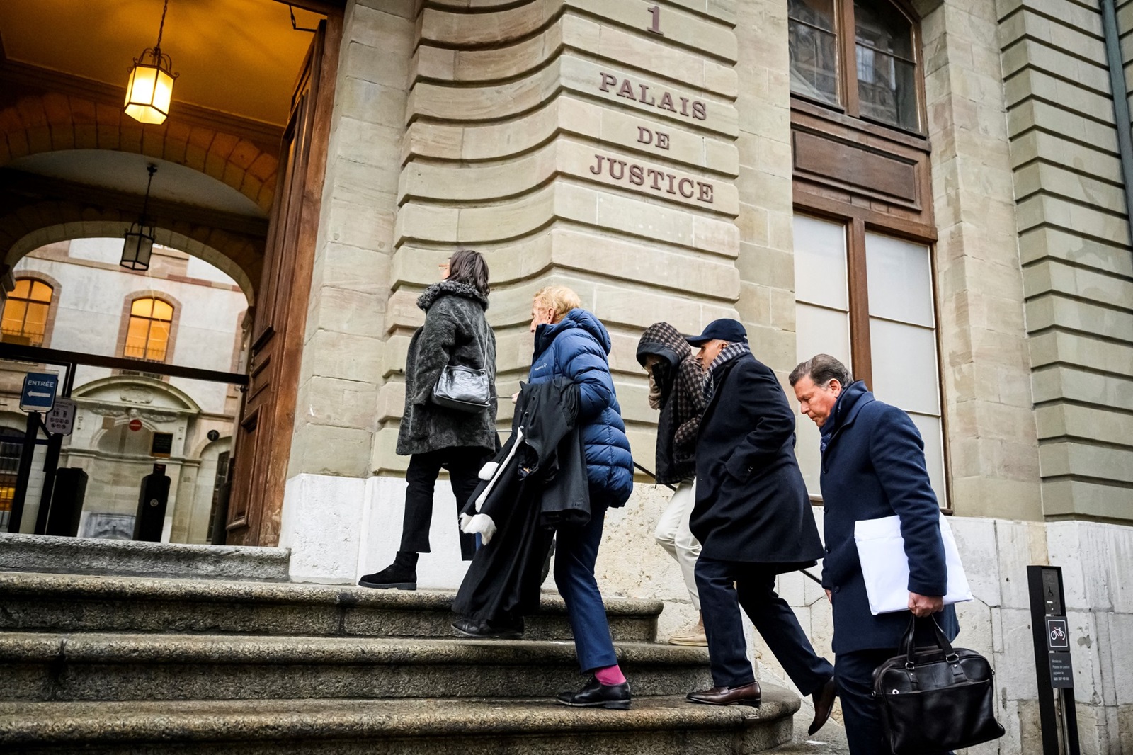 (FILES) Indian-Swiss billionaire family members Namrata Hinduja (3rdR) and Ajay Hinduja (2ndR) arrive at the Geneva’s courthouse with their lawyers Yael Hayat (L) and Robert Assael (2ndL) at the opening day of their trial for human trafficking on January 15, 2024.  A Swiss court on June 21, 2024, acquitted four members of Britain's richest family, the Hindujas, of human trafficking charges over treatment of domestic employees, and nonetheless sentenced them to heavy prison terms of four years or more for exploiting the Indian staff at their villa.,Image: 883614869, License: Rights-managed, Restrictions: , Model Release: no, Credit line: GABRIEL MONNET / AFP / Profimedia