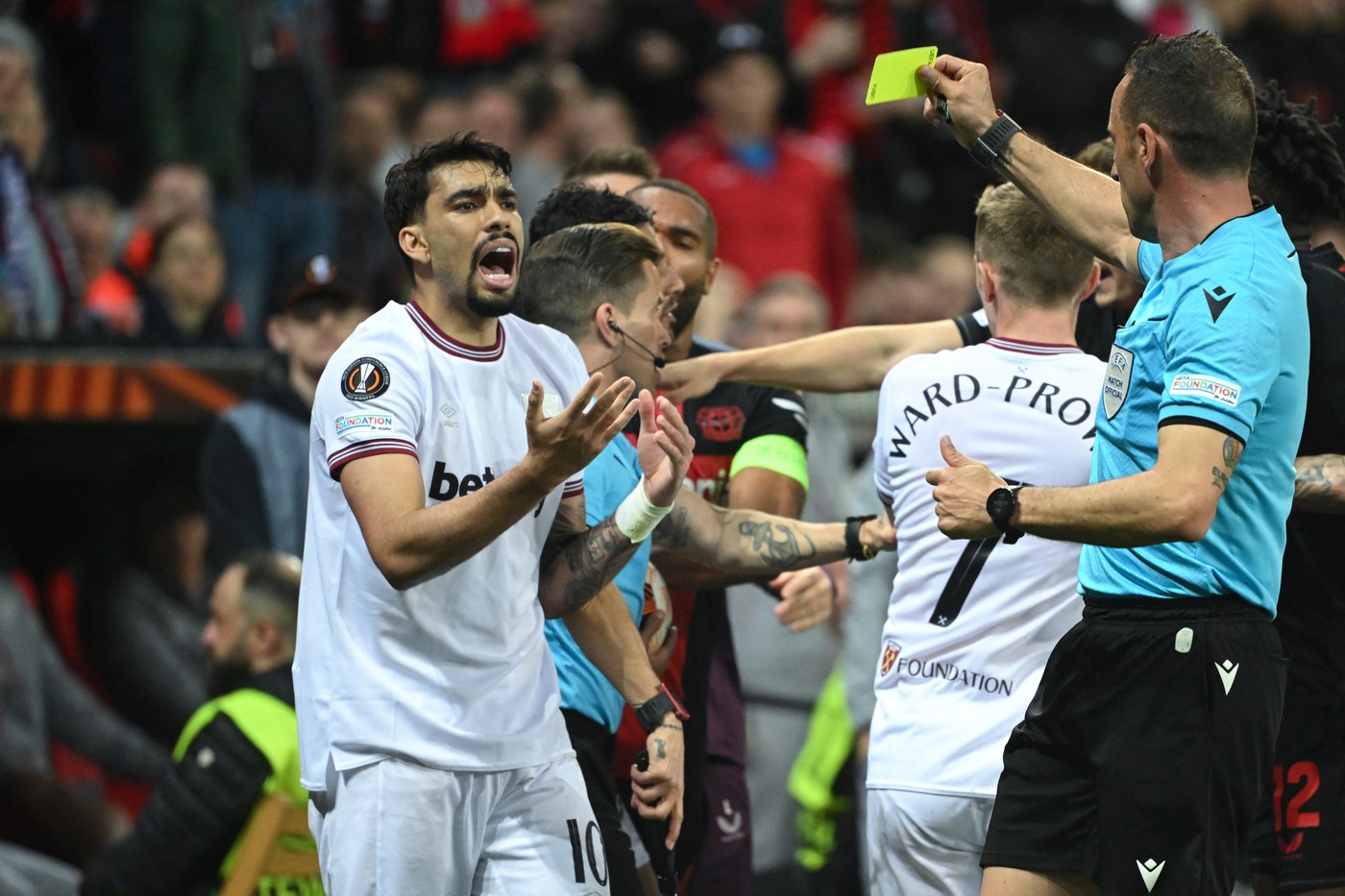 West Ham United's Brazilian midfielder #10 Lucas Paqueta reacts after receiving a yellow card for a tackle on Bayer Leverkusen's French forward #21 Amine Adli (not pictured) during the UEFA Europa League quarter-final first leg football match between Bayer 04 Leverkusen and West Ham United FC in Leverkusen, western Germany on April 11, 2024.,Image: 864124293, License: Rights-managed, Restrictions: , Model Release: no, Credit line: INA FASSBENDER / AFP / Profimedia