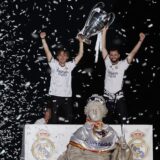 Real Madrid's Croatian midfielder #10 Luka Modric (L) and Real Madrid's Spanish defender #06 Nacho Fernandez celebrate with the trophy their 15th Champions League win, one day after beating Borussia Dortmund in London, on Cibeles square in Madrid on June 2, 2024.,Image: 878382646, License: Rights-managed, Restrictions: , Model Release: no, Credit line: Thomas COEX / AFP / Profimedia