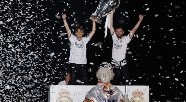 Real Madrid's Croatian midfielder #10 Luka Modric (L) and Real Madrid's Spanish defender #06 Nacho Fernandez celebrate with the trophy their 15th Champions League win, one day after beating Borussia Dortmund in London, on Cibeles square in Madrid on June 2, 2024.,Image: 878382646, License: Rights-managed, Restrictions: , Model Release: no, Credit line: Thomas COEX / AFP / Profimedia