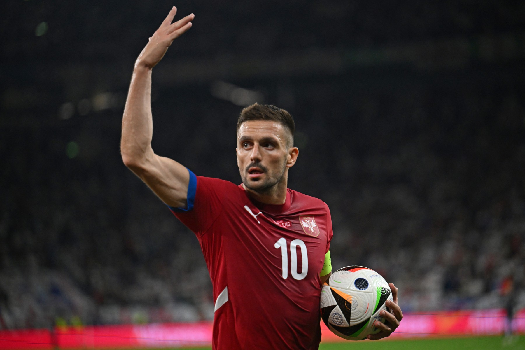 Serbia's forward #10 Dusan Tadic interacts with the fans during the UEFA Euro 2024 Group C football match between Serbia and England at the Arena AufSchalke in Gelsenkirchen on June 16, 2024.,Image: 882168264, License: Rights-managed, Restrictions: , Model Release: no, Credit line: OZAN KOSE / AFP / Profimedia