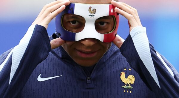 France's forward #10 Kylian Mbappe adjusts his face mask as he takes part in a MD-1 training session at the Leipzig Stadium in Leipzig on June 20, 2024, on the eve of their UEFA Euro 2024 Group D football match against Netherlands.,Image: 883354044, License: Rights-managed, Restrictions: , Model Release: no, Credit line: FRANCK FIFE / AFP / Profimedia