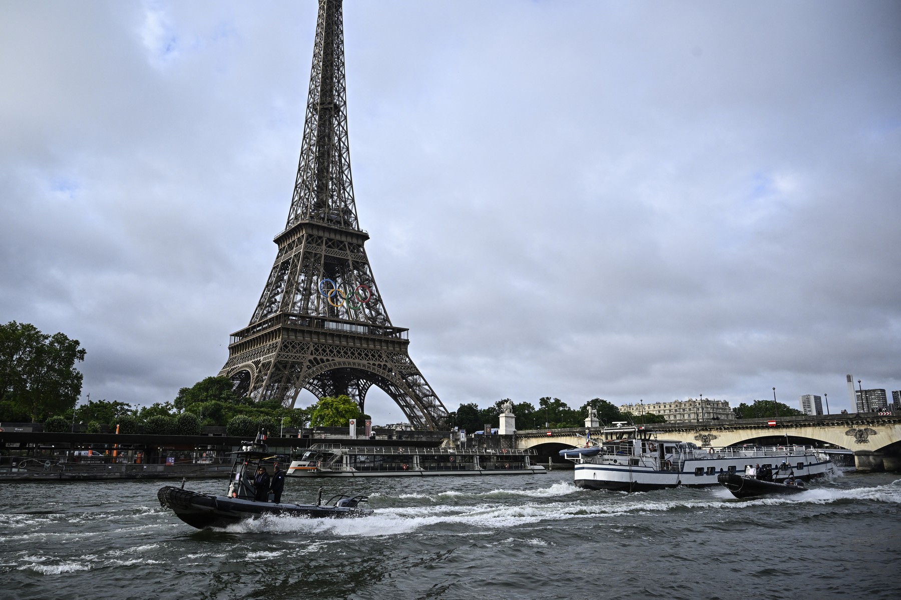 (FILES) Police boats participate in a technical navigation rehearsal on the Seine river for the opening ceremony of the Paris 2024 Olympic Games, in Paris, on June 17, 2024. The rehearsal of the opening ceremony of the Olympic Games, which was due to be held on June 24 with the entire fleet of boats, has been postponed due to the high flow of the Seine, AFP learned on June 21 from the prefecture of the Ile-de-France region.,Image: 883682607, License: Rights-managed, Restrictions: , Model Release: no, Credit line: JULIEN DE ROSA / AFP / Profimedia