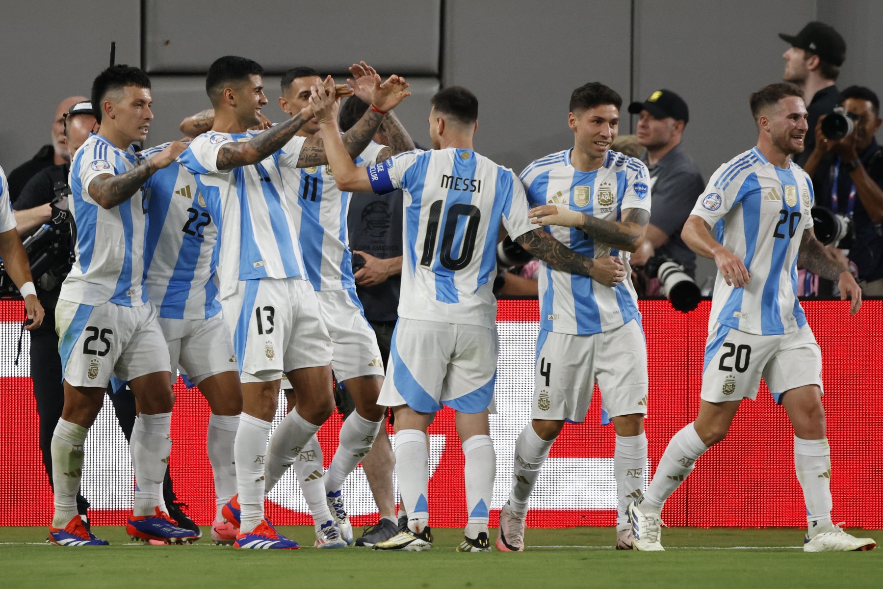 Argentina's players celebrate after scoring a goal during the Conmebol 2024 Copa America tournament group A football match between Chile and Argentina at MetLife Stadium in East Rutherford, New Jersey on June 25, 2024.,Image: 884736141, License: Rights-managed, Restrictions: , Model Release: no, Credit line: EDUARDO MUNOZ / AFP / Profimedia