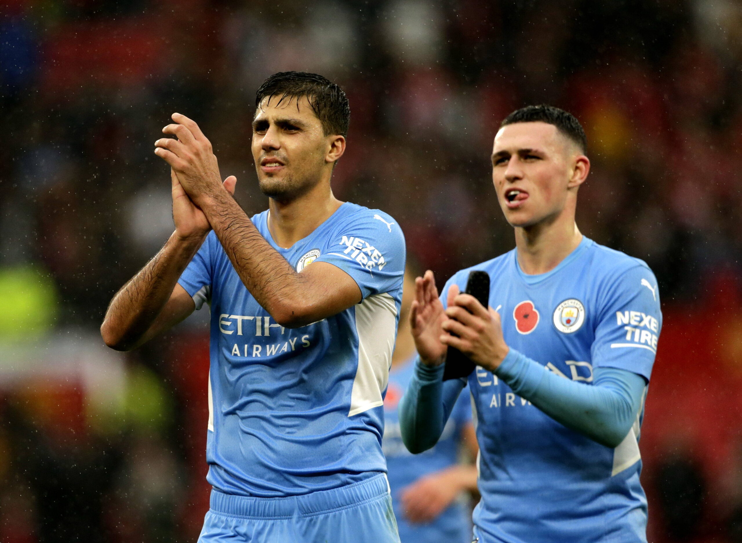 Football - 2021 / 2022 Premier League - Manchester United, ManU vs Manchester City - Old Trafford - Saturday 6th November 2021 Rodri and Phil Foden of Manchester City applaud their fans at the end of the game, having won 2-0 at Old Trafford PUBLICATIONxNOTxINxUK