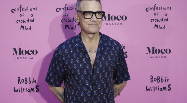 Singer Robbie Williams poses at the photocall of the exhibition 'Confessions', at the Moco Museum, on June 20, 2024, in Madrid (Spain). Robbie Williams is showing from this week 17 of his artworks at the Moco Museum in Barcelona, in an exhibition titled 'Confessions Of A Crowded Mind' that opens today. The exhibition aims to reflect on mental health. 20 JUNE 2024 Kike Rincón / Europa Press 06/20/2024 (Europa Press via AP)