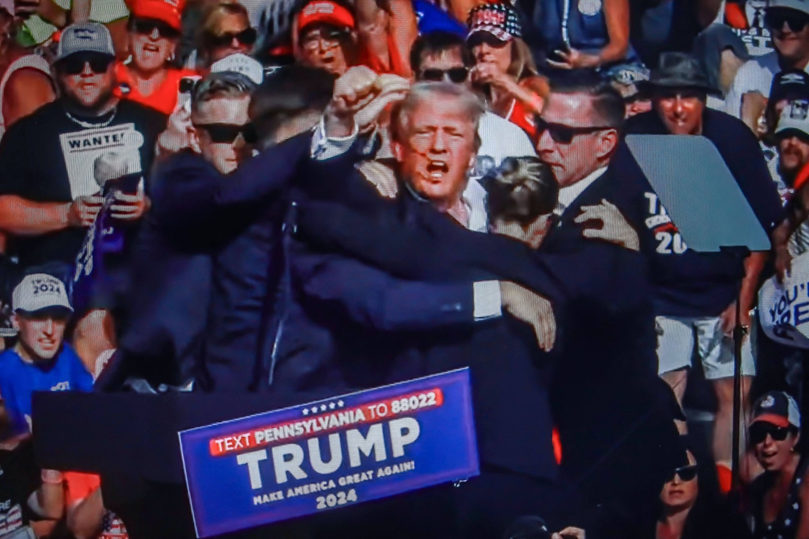 July 14, 2024, Butler, Pennsylvania, United States: In this photo illustration, a screen shows Former US President Donald Trump shot in the ear at a rally he was holding in Butler. Former US President Donald Trump was wounded in a shooting at a rally he was holding in Butler, Pennsylvania as part of his election campaign ahead of the 2024 US Presidential election. According to the latest reports, secret agents killed a shooter and one rally participant died at the hands of the shooter himself, the shooting at the rally is being investigated as an attempted assassination of former President Trump, the Associated Press reports, citing the Butler County District Attorney.
14 Jul 2024
Pictured: July 14, 2024, Butler, Pennsylvania, United States: In this photo illustration, a screen shows Former US President Donald Trump shot in the ear at a rally he was holding in Butler. Former US President Donald Trump was wounded in a shooting at a rally he was holding in Butler, Pennsylvania as part of his election campaign ahead of the 2024 US Presidential election. According to the latest reports, secret agents killed a shooter and one rally participant died at the hands of the shooter himself, the shooting at the rally is being investigated as an attempted assassination of former President Trump, the Associated Press reports, citing the Butler County District Attorney.,Image: 889593193, License: Rights-managed, Restrictions: NO Argentina, Australia, Bolivia, Brazil, Chile, Colombia, Finland, France, Georgia, Hungary, Japan, Mexico, Netherlands, New Zealand, Poland, Romania, Russia, South Africa, Uruguay, Model Release: no, Credit line: ZUMAPRESS.com / MEGA / The Mega Agency / Profimedia