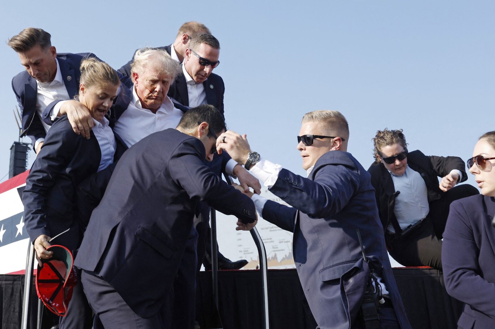 BUTLER, PENNSYLVANIA - JULY 13: Republican presidential candidate former President Donald Trump is rushed offstage during a rally on July 13, 2024 in Butler, Pennsylvania.   Anna Moneymaker,Image: 889546893, License: Rights-managed, Restrictions: , Model Release: no, Credit line: Anna Moneymaker / Getty images / Profimedia