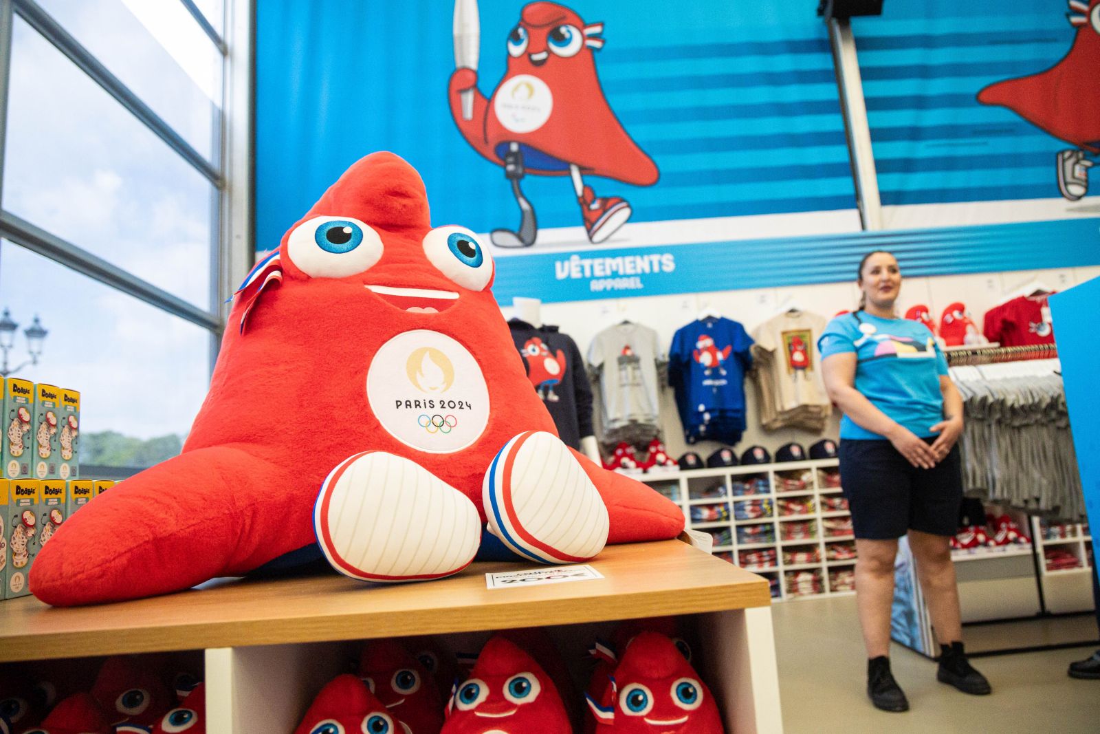 epa11441230 Stuffed toys depicting the Phryges, the official mascot of the Paris 2024 Games, on display at the Paris 2024 official store on the Champs-Elysees on its opening day in Paris, France, 27 June 2024. The Paris 2024 store on Champs-Elysees, the largest of the official Olympic stores, will be open from 27 June until 15 September 2024.  EPA/CHRISTOPHE PETIT TESSON