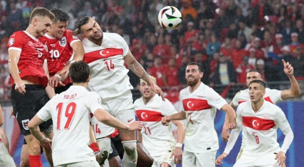 epa11453725 Stefan Posch (L) of Austria goes for a header during the UEFA EURO 2024 Round of 16 soccer match between Austria and Turkey, in Leipzig, Germany, 02 July 2024.  EPA/ABEDIN TAHERKENAREH