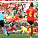 epa11460038 Daniel Olmo of Spain (C) scores the 1-0 during the UEFA EURO 2024 quarter-finals soccer match between Spain and Germany, in Stuttgart, Germany, 05 July 2024.  EPA/FRIEDEMANN VOGEL