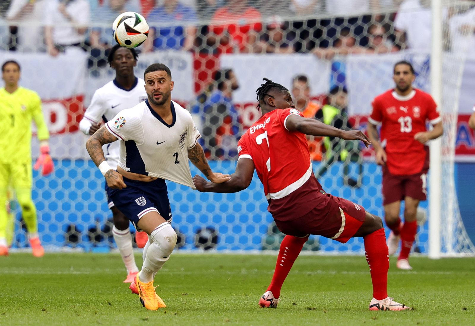 epa11462872 Kyle Walker of England (L) and Breel Embolo of Switzerland in action during the UEFA EURO 2024 quarter-finals soccer match between England and Switzerland, in Dusseldorf, Germany, 06 July 2024.  EPA/RONALD WITTEK