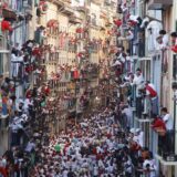 epa11464325 People gather during the running of the bulls of San Fermin festival (known as 'Sanfermines') in Pamplona, northern Spain, 07 July 2024. The San Fermin festival 2024 runs from 06 to 14 July, with the running of the bulls as main event.  EPA/VILLAR LOPEZ