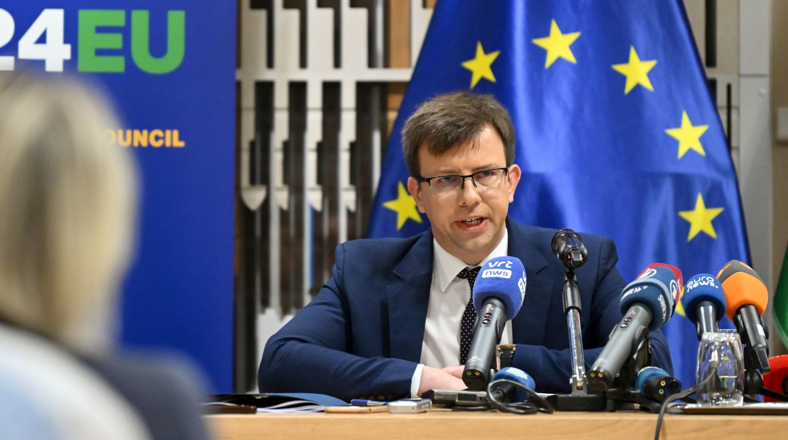 epa11470056 Hungarian minister for EU Affairs Janos Boka (L, background) speaks during a press conference in the building of the Permanent Representation of Hungary to the European Union in Brussels, Belgium, 10 July 2024. The minister stated that Hungary aims to improve the competitiveness of the European Union during the current Hungarian presidency of the Council of the EU.  EPA/Tamas Purger HUNGARY OUT