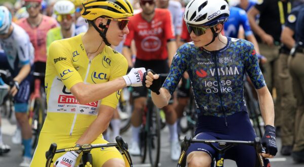 epa11472096 Yellow jersey Slovenian rider Tadej Pogacar (L) of UAE Team Emirates and Danish rider Jonas Vingegaard of Team Visma Lease a Bike bump fists as they stand at the start line of the 12th stage of the 2024 Tour de France cycling race over 203km from Aurillac to Villeneuve-sur-Lot, France, 11 July 2024.  EPA/GUILLAUME HORCAJUELO