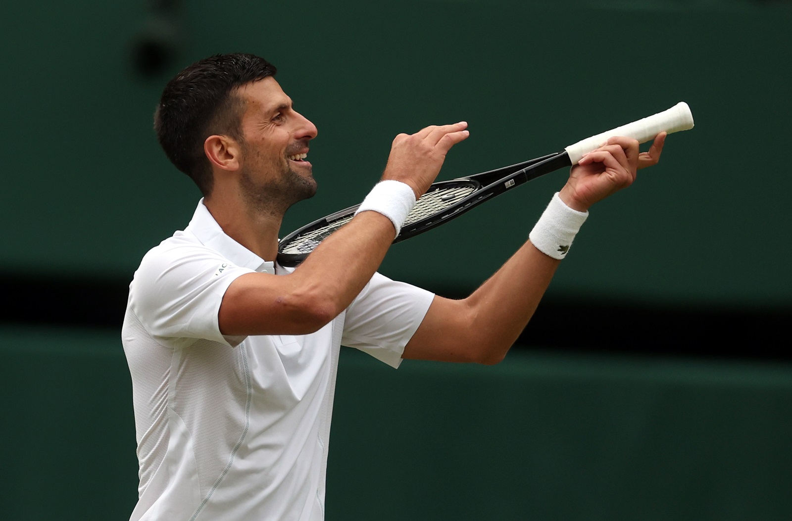 epa11474980 Novak Djokovic of Serbia reacts after winning the Men's semifinal match against Lorenzo Musetti of Italy at the Wimbledon Championships, Wimbledon, Britain, 12 July 2024.  EPA/NEIL HALL  EDITORIAL USE ONLY