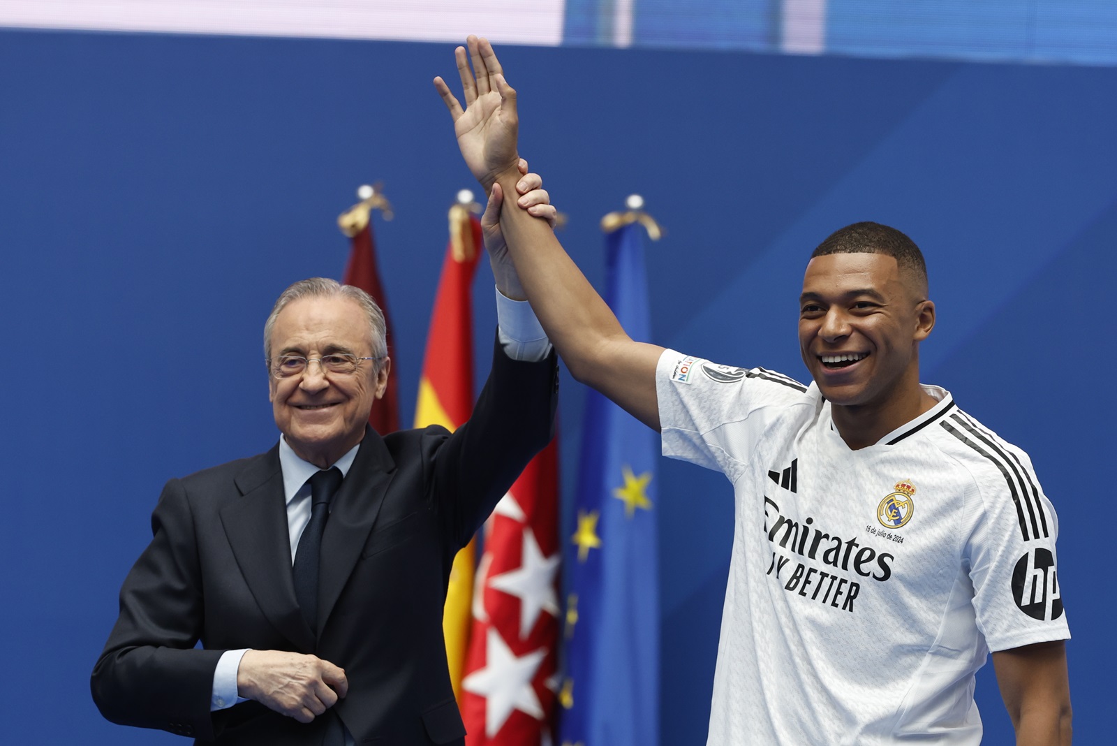 epaselect epa11481277 Real Madrid's President Florentino Perez (L) stands next to French soccer player Kylian Mbappe (R) during his presentation as Real Madrid's newest team member, at Santiago Bernabeu Stadium in Madrid, Spain, 16 July 2024. With the number 9 on his back, the Paris-born captain of the French national team said the move to the Bernabeu was a dream come true.  EPA/Chema Moya