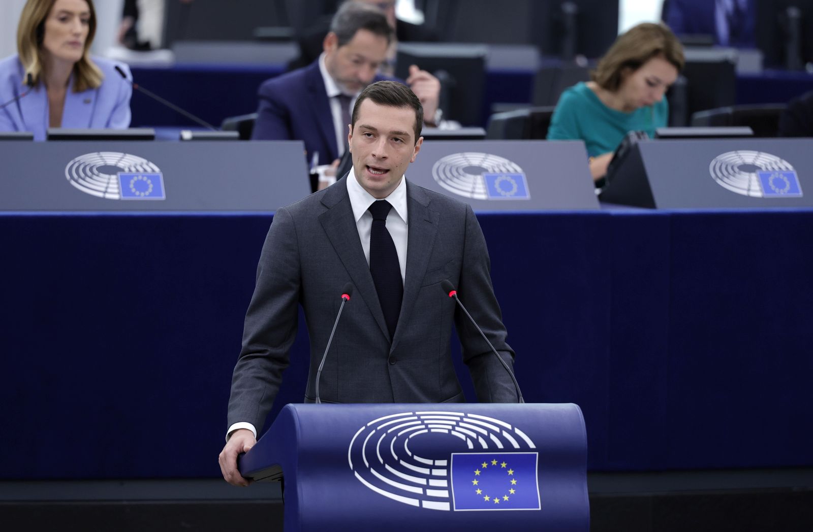 epa11483038 Jordan Bardella (C), leader of France's far-right National Rally (RN) party and head of the right-wing group 'Patriots for Europe' in the European Parliament, speaks during a debate on 'Parliament's statements - The need for the EU's continuous support for Ukraine' as part of the plenary session at the European Parliament in Strasbourg, France, 17 July 2024. The first session of the new European Parliament opened on 16 July, with MEPs due to elect their president and vice-presidents for the next two and a half years. Roberta Metsola was re-elected as President of the European Parliament until 2027, with 562 votes in the first round. The EU Parliament's session runs from 16 to 19 July 2024.  EPA/RONALD WITTEK