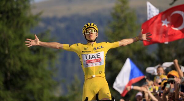 epa11489401 Yellow jersey Slovenian rider Tadej Pogacar of UAE Team Emirates celebrates as he crosses the finish line and winning the 20th stage of the 2024 Tour de France cycling race over 132km from Nice to Col de la Couillole, France, 20 July 2024.  EPA/GUILLAUME HORCAJUELO
