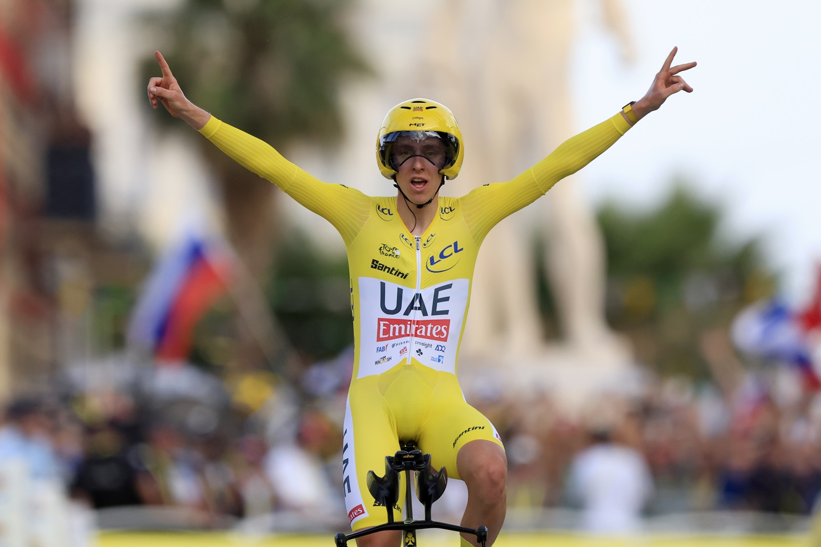 epa11490628 Yellow jersey Slovenian rider Tadej Pogacar of UAE Team Emirates celebrates as he crosses the finish line and winning the 21th stage of the 2024 Tour de France cycling race over 33km Individual time-trial (ITT) from Monaco to Nice, 21 July 2024.  EPA/GUILLAUME HORCAJUELO