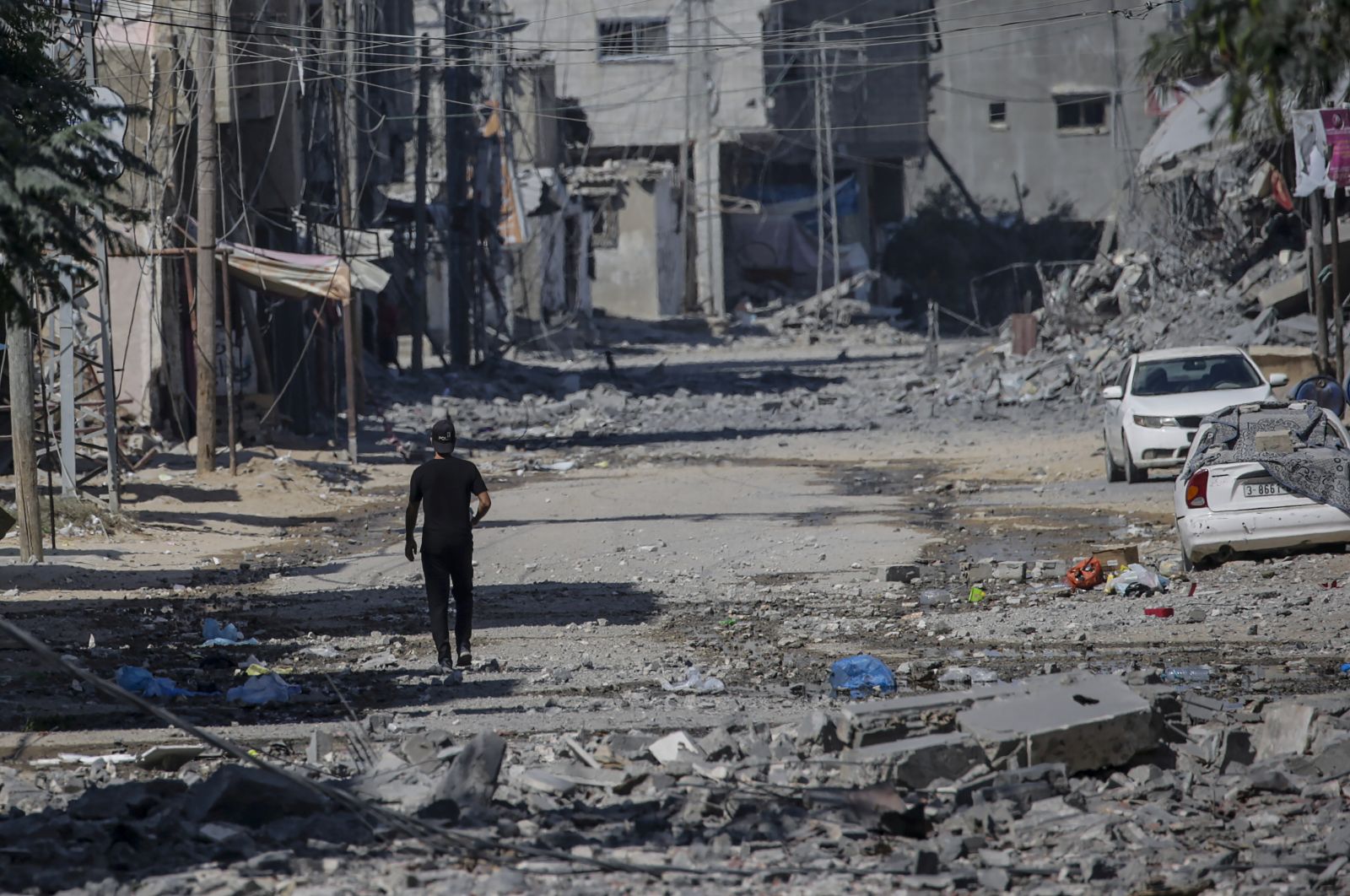 epa11490873 A Palestinian man walks among the rubble following an Israeli airstrike in the Al Nusairat refugee camp, central Gaza Strip, 21 July 2024. More than 38,000 Palestinians and over 1,400 Israelis have been killed, according to the Palestinian Health Ministry and the Israel Defense Forces (IDF), since Hamas militants launched an attack against Israel from the Gaza Strip on 07 October 2023, and the Israeli operations in Gaza and the West Bank which followed it.  EPA/MOHAMMED SABER