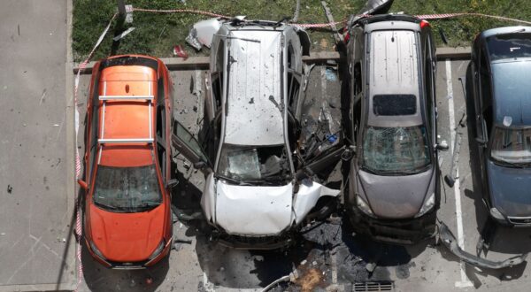 epa11493607 A view of the site of a car blast in Moscow, Russia, 24 July 2024. At least two people have been injured after an unidentified object detonated in a car in a parking lot in the north of the capital Moscow, Interior Ministry spokeswoman Irina Volk wrote on telegram. The injured were transported by ambulance to a medical facility, her statement added. Police officers are investigating the incident.  EPA/YURI KOCHETKOV