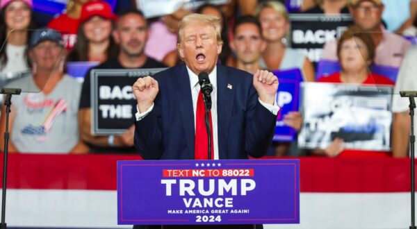 epa11495038 Republican presidential candidate Donald J. Trump gestures during a campaign rally at Bojangles Coliseum in Charlotte, North Carolina, USA, 24 July 2024.  EPA/DAVID JENSEN
