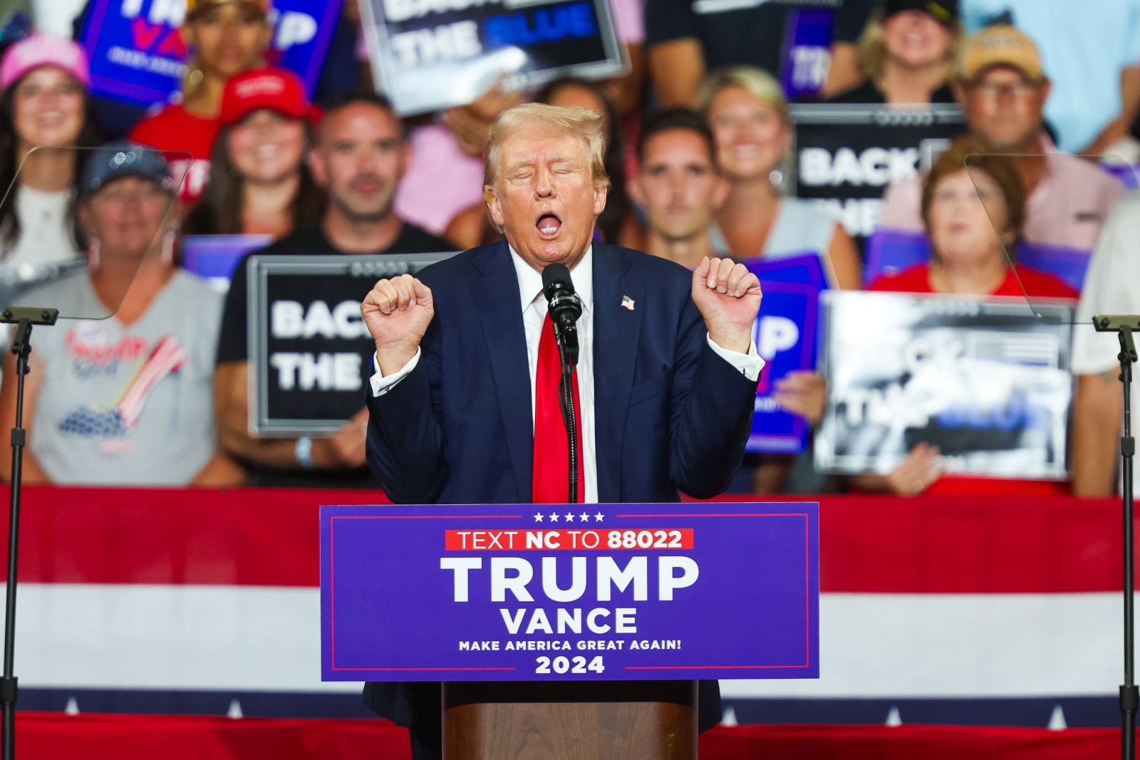 epa11495038 Republican presidential candidate Donald J. Trump gestures during a campaign rally at Bojangles Coliseum in Charlotte, North Carolina, USA, 24 July 2024.  EPA/DAVID JENSEN