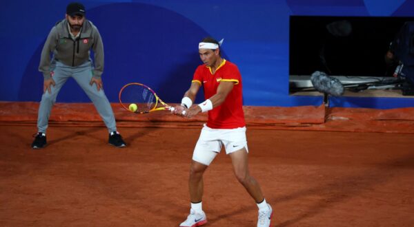 epa11500425 Rafael Nadal and Carlos Alcaraz (not pictured) of Spain in action during their Men's Doubles first round match against Maximo Gonzalez and Andres Molteni of Argentina at the Tennis competitions in the Paris 2024 Olympic Games, at the Roland Garros in Paris, France, 27 July 2024.  EPA/DIVYAKANT SOLANKI