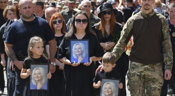 epa11491488 Relatives of Ukrainian former MP Iryna Farion carry her photos during her funeral procession in Lviv, Ukraine, 22 July 2024. Linguist and nationalist politician Iryna Farion died in hospital on the evening of 19 July after an unknown person shot her earlier that day near her house in Lviv, the National Police said. According to Ukrainian President Volodymyr Zelensky, the National Police of Ukraine and the Security Service of Ukraine have been deployed to search for the shooter as the investigation into her murder was ongoing.  EPA/MYKOLA TYS