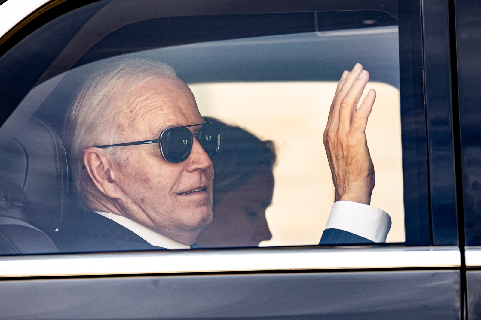 epa11490669 (FILE) - US President Joe Biden greets from his car as he leaves Elysee palace after a joint statement with France's President Macron (not pictured) in Paris, France, 08 June 2024 (reissued 21 July 2024). Joe Biden on 21 July announced he would not seek re-election in November 2024. “While it has been my intention to seek reelection, I believe it is in the best interest of my party and the country for me to stand down and to focus solely on fulfilling my duties as President for the remainder of my term”, Biden announced on his X (formerly Twitter) account.  EPA/CHRISTOPHE PETIT TESSON