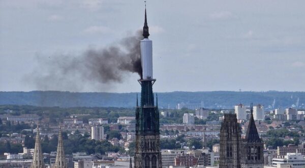 Smoke billows from the spire of Rouen Cathedral in Rouen, northern France on July 11, 2024.  Mayor of Rouen Nicolas Mayer-Rossignol said midday on X, that a fire was in progress on the cathedral showing a photograph of a plume of smoke escaping from scaffolding surrounding the spire.,Image: 889006107, License: Rights-managed, Restrictions: , Model Release: no, Credit line: Patrick STREIFF / AFP / Profimedia