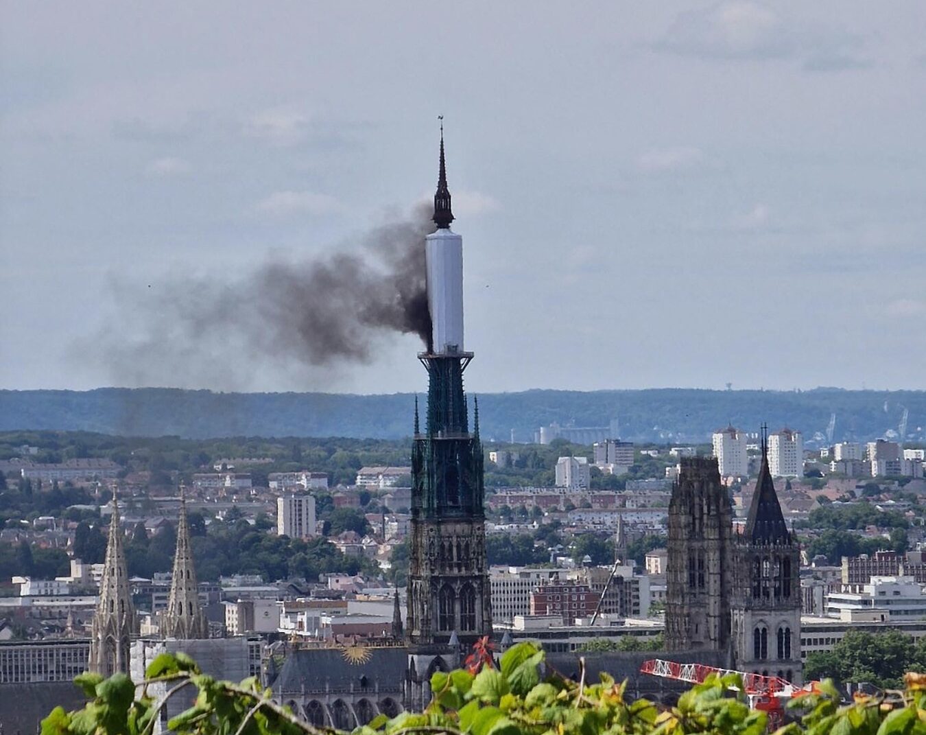 Smoke billows from the spire of Rouen Cathedral in Rouen, northern France on July 11, 2024.  Mayor of Rouen Nicolas Mayer-Rossignol said midday on X, that a fire was in progress on the cathedral showing a photograph of a plume of smoke escaping from scaffolding surrounding the spire.,Image: 889006107, License: Rights-managed, Restrictions: , Model Release: no, Credit line: Patrick STREIFF / AFP / Profimedia