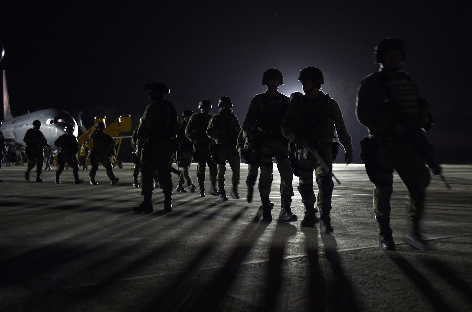 Members of the Mexican Army Special Forces arrive to the Airport of Culiacan, Sinaloa state, Mexico, on October 18, 2019.  Mexico's president faced a firestorm of criticism Friday as his security forces confirmed they arrested kingpin Joaquin "El Chapo" Guzman's son, then released him when his cartel responded with an all-out gun battle.,Image: 477721962, License: Rights-managed, Restrictions: , Model Release: no, Credit line: ALFREDO ESTRELLA / AFP / Profimedia