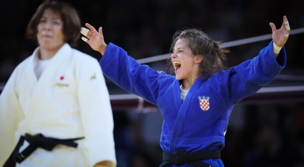 Croatian Katarina Kristo (blue gi) celebrates after winning a judo bout against Japanese Takaich (white gi) in the elimination round of 16 of the -63kg category of the women's judo competition at the Paris 2024 Olympic Games, on Tuesday 30 July 2024 in Paris, France. The Games of the XXXIII Olympiad are taking place in Paris from 26 July to 11 August. The Belgian delegation counts 165 athletes competing in 21 sports. BELGA PHOTO BENOIT DOPPAGNE Photo: BENOIT DOPPAGNE/PIXSELL