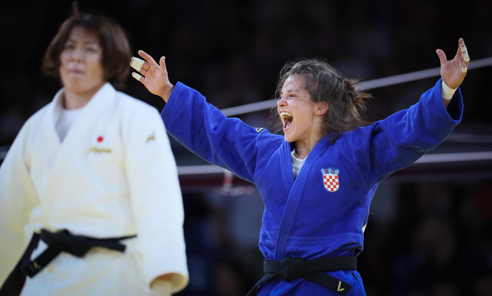 Croatian Katarina Kristo (blue gi) celebrates after winning a judo bout against Japanese Takaich (white gi) in the elimination round of 16 of the -63kg category of the women's judo competition at the Paris 2024 Olympic Games, on Tuesday 30 July 2024 in Paris, France. The Games of the XXXIII Olympiad are taking place in Paris from 26 July to 11 August. The Belgian delegation counts 165 athletes competing in 21 sports. BELGA PHOTO BENOIT DOPPAGNE Photo: BENOIT DOPPAGNE/PIXSELL