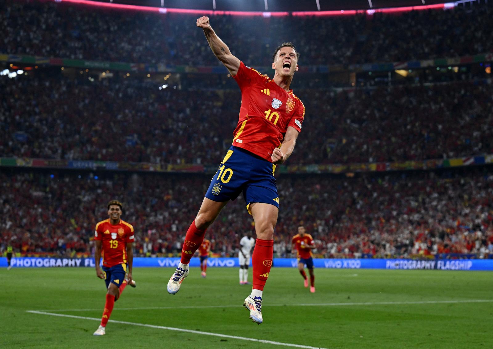 Soccer Football - Euro 2024 - Semi Final - Spain v France - Munich Football Arena, Munich, Germany - July 9, 2024  Spain's Dani Olmo celebrates their second goal, an own goal scored by France's Jules Kounde REUTERS/Annegret Hilse Photo: Annegret Hilse/REUTERS