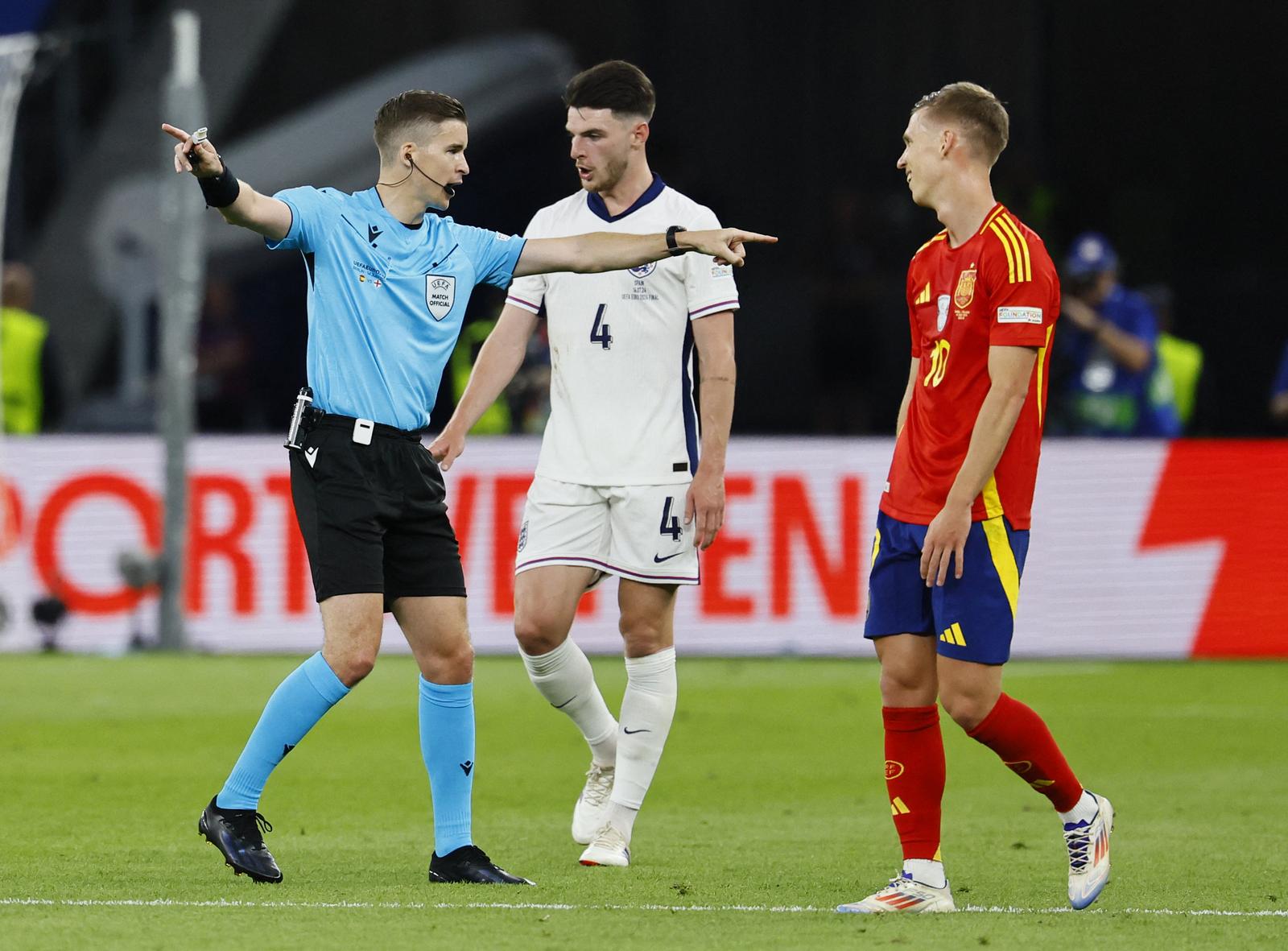 Soccer Football - Euro 2024 - Final - Spain v England - Berlin Olympiastadion, Berlin, Germany - July 14, 2024 England's Declan Rice and Spain's Dani Olmo react as referee Francois Letexier signals REUTERS/Wolfgang Rattay Photo: Wolfgang Rattay/REUTERS