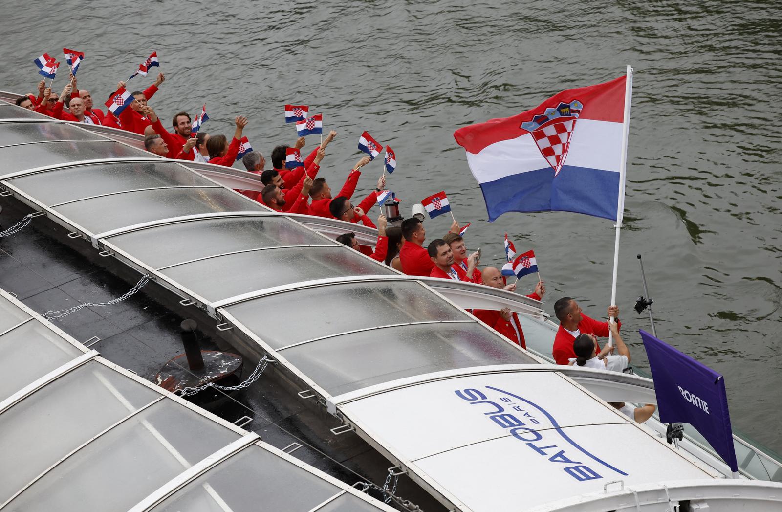 Paris 2024 Olympics - Opening Ceremony - Paris, France - July 26, 2024. Athletes of Croatia aboard a boat in the floating parade on the river Seine during the opening ceremony. REUTERS/Albert Gea Photo: ALBERT GEA/REUTERS