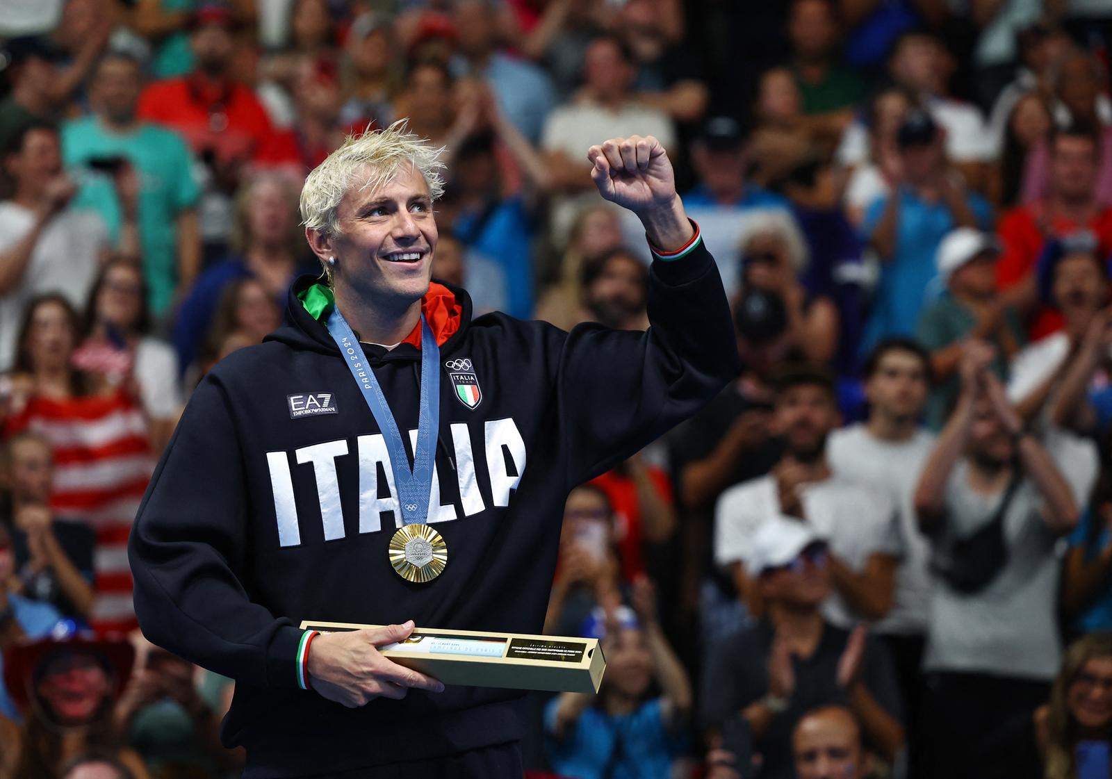 Paris 2024 Olympics - Swimming - Men's 100m Breaststroke Victory Ceremony - Paris La Defense Arena, Nanterre, France - July 28, 2024. Gold medallist Nicolo Martinenghi of Italy celebrates on the podium. REUTERS/Evgenia Novozhenina Photo: EVGENIA NOVOZHENINA/REUTERS